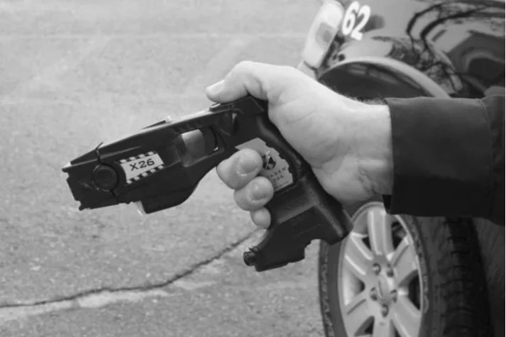 A stun gun used by correctional officers to incapacitate a person by administering an electrical shock.