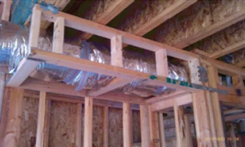 Ducting enclosed in a framed soffit within living space.